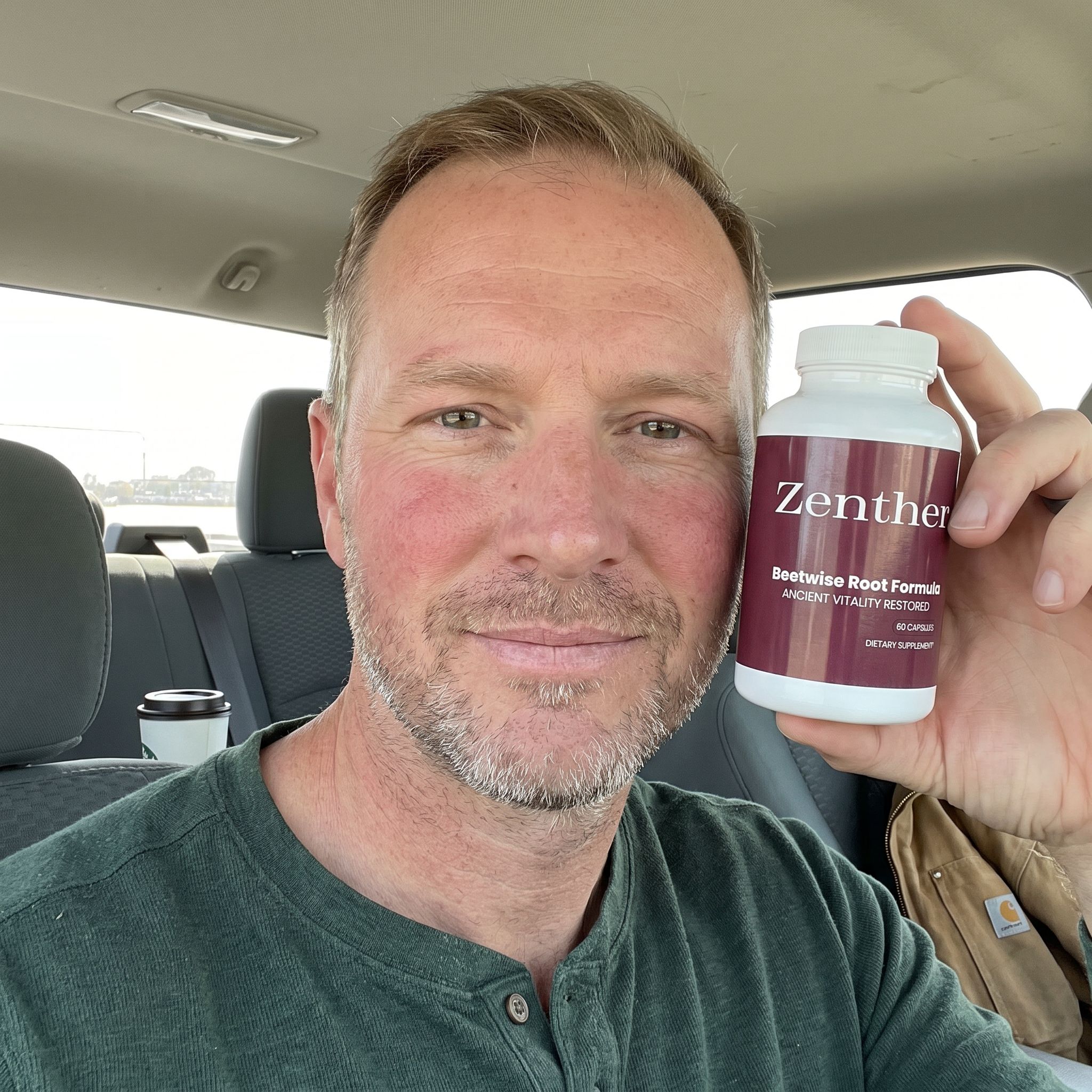 Man in his 40s holding a bottle of Zenther BeetWise Root Formula